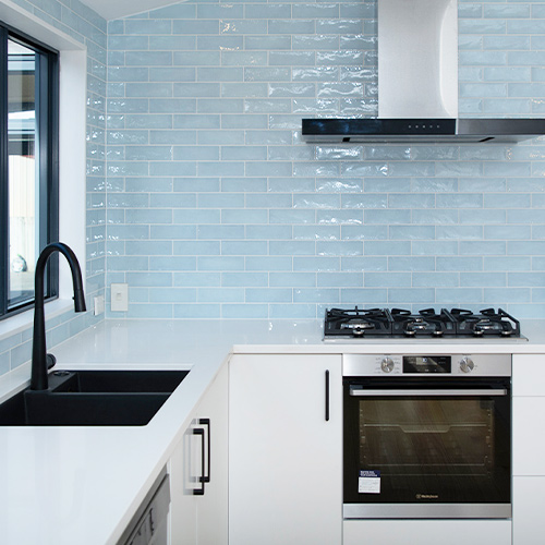 Blue tiles on kitchen wall